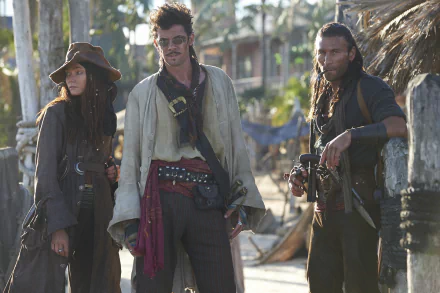 Scene from Black Sails featuring Clara Paget as Anne Bonny, Toby Schmitz as Jack Rackham, and Zach McGowan as Charles Vane in pirate attire, displayed in 4K Ultra HD.