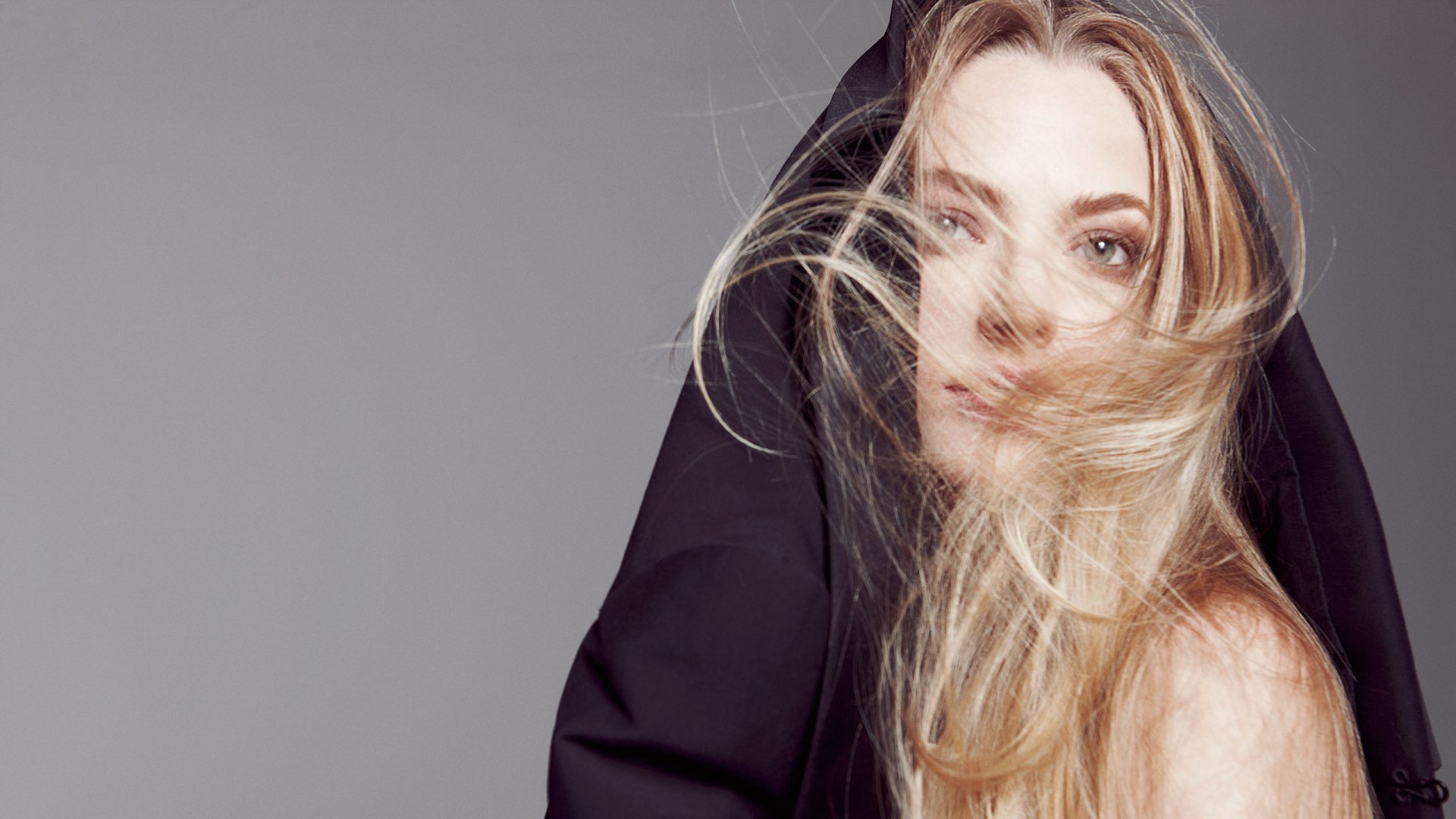 HD desktop wallpaper featuring Australian model and celebrity Gemma Ward with flowing blonde hair partially covered by a black garment.