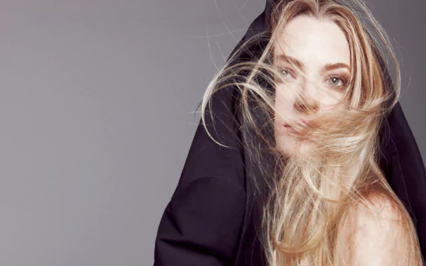 HD desktop wallpaper featuring Australian model and celebrity Gemma Ward with flowing blonde hair partially covered by a black garment.