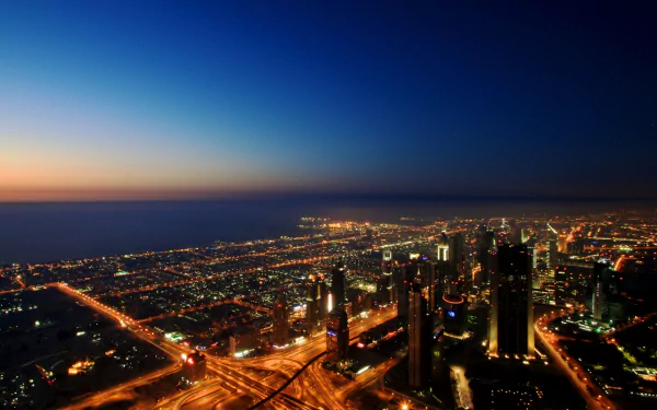 A stunning 4K Ultra HD night view of Dubai’s illuminated man-made skyline and sprawling cityscape.