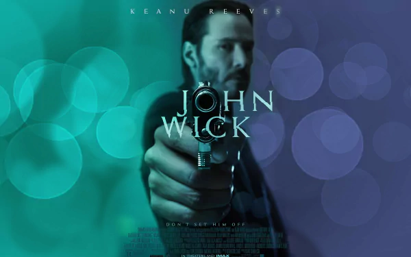 HD desktop wallpaper featuring a dramatic scene from the movie John Wick, showcasing the main character aiming a gun, with a blend of vibrant colors in the background.