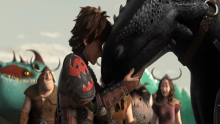 Hiccup and Toothless share a touching moment in this HD desktop wallpaper from How to Train Your Dragon 2, with other characters standing in the background.