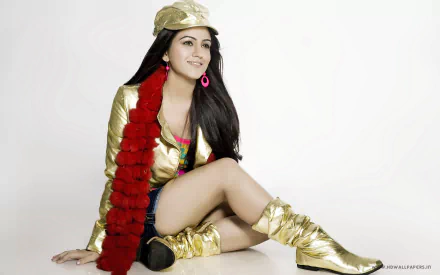 HD Bollywood desktop wallpaper featuring actress Aksha Pardasany in gold attire with a red scarf, seated against a white background.