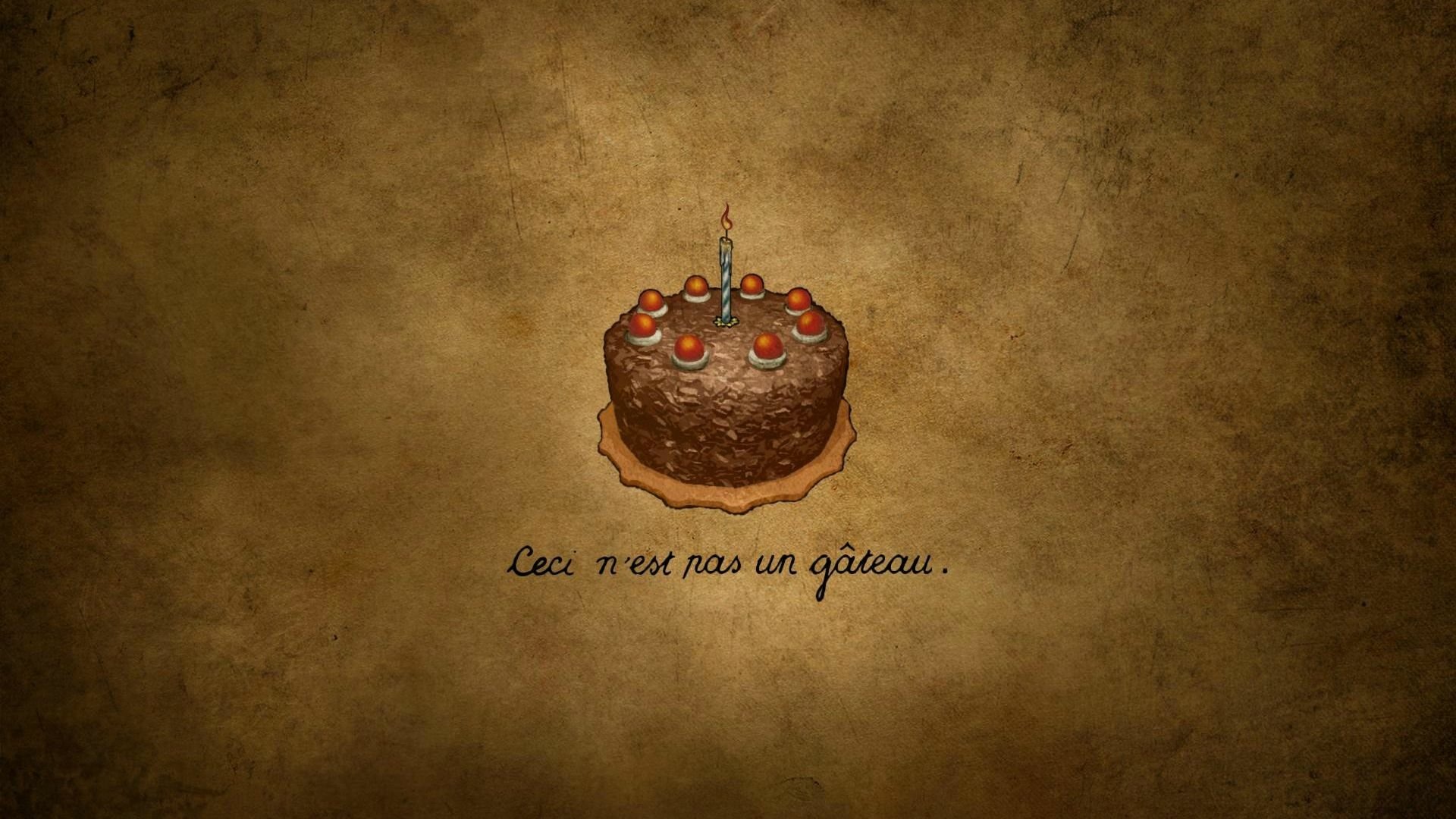 HD PC desktop wallpaper featuring a Portal 2-themed birthday cake with candles and the phrase Ceci n'est pas un gâteau on a textured brown background.