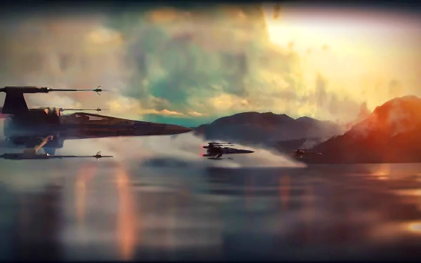 HD wallpaper from Star Wars Episode VII: The Force Awakens, featuring iconic starfighters flying over a misty landscape with mountains in the background, under a dramatic sky.