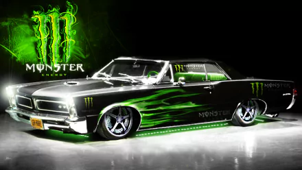 A sleek black car with green Monster Energy logos and flames stands out against a dark background, designed as an HD desktop wallpaper showcasing man-made automotive creativity.
