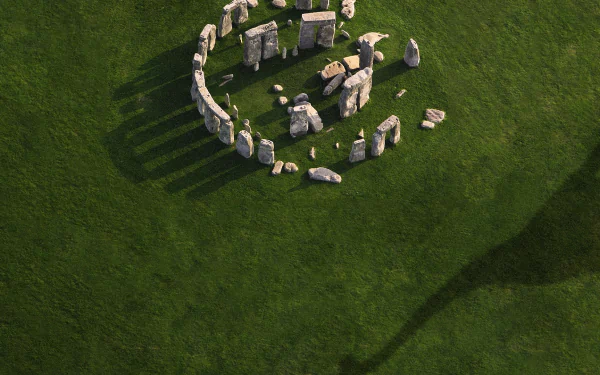 HD PC desktop wallpaper featuring a scene from the movie Jurassic World with ancient stone structures casting long shadows on green grass.