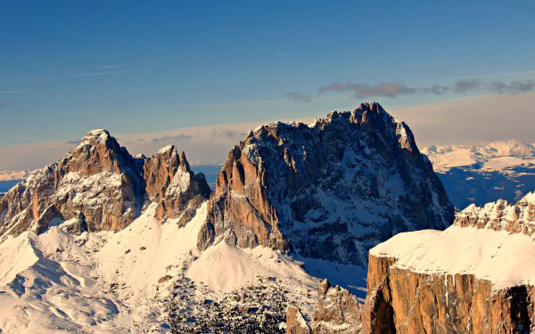 Stunning view of snow-covered peaks in the Alps, capturing the natural beauty of winter landscapes. A vibrant 4K Ultra HD wallpaper for your desktop background.