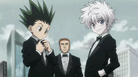 HD wallpaper of Gon Freecss and Killua Zoldyck from Hunter x Hunter in suits against a city backdrop.