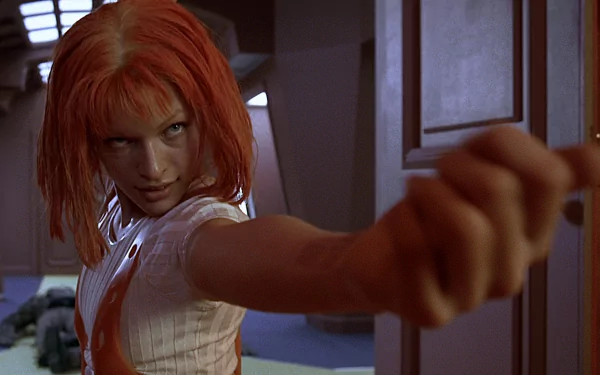 Leeloo from *The Fifth Element*, portrayed by Milla Jovovich, striking a dynamic pose, showcasing her iconic orange hair and fierce expression in this HD desktop wallpaper.