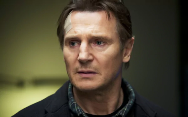 HD desktop wallpaper featuring a serious-looking man with a bandaged head, set against a dark background.
