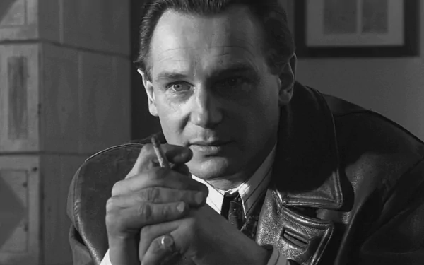 HD desktop wallpaper featuring a black and white image of a man in a leather jacket, looking thoughtful.