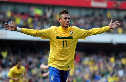 Neymar celebrates a goal in a vibrant yellow Brazilian jersey, surrounded by an excited crowd, creating an engaging sports-themed HD desktop wallpaper.