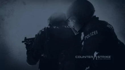 A dynamic HD wallpaper featuring characters from Counter-Strike: Global Offensive, showcasing two operatives in tactical gear, ready for action in a shadowy environment.