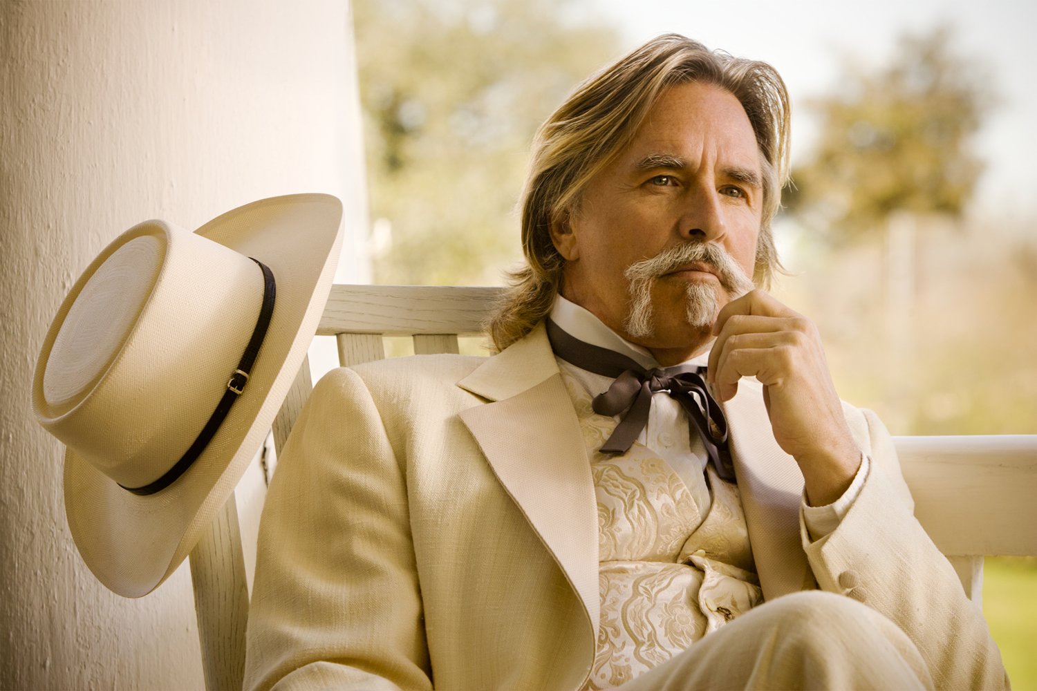 HD PC desktop wallpaper and background: contemplative Southern gentleman character from the movie Django Unchained, seated on a porch in a white suit and hat.