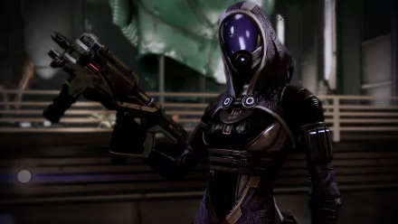 HD PC desktop wallpaper featuring Tali'Zorah from the video game Mass Effect, showcasing her in detailed armor holding a futuristic weapon.