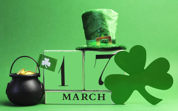 A vibrant St. Patrick's Day desktop wallpaper featuring a green top hat, a pot of gold, and festive decorations, celebrating March 17 with a lively, cheerful vibe.