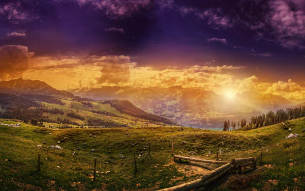 Sunset glow over a lush Swiss valley with dramatic clouds and vibrant sky, captured in stunning 8K Ultra HD landscape photography.