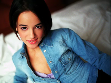 HD PC desktop wallpaper featuring Alizée, the music artist, with a close-up of her smiling in a denim shirt against a soft background.