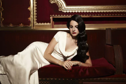 HD PC desktop wallpaper featuring Lana Del Rey in a vintage-inspired setting, wearing a white gown, embodying a moody and elegant music-themed atmosphere.