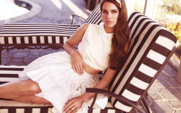 4K Ultra HD PC desktop wallpaper: portrait of a female music artist reclining on a striped outdoor chaise, sunlit, vintage-inspired, dreamy pop aesthetic.