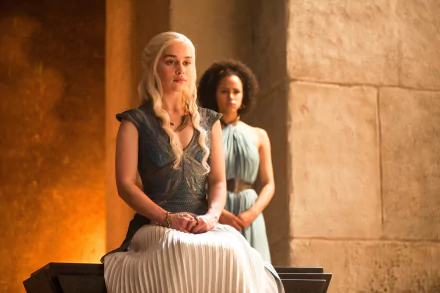 A scene from *Game of Thrones* featuring Daenerys Targaryen, portrayed by Emilia Clarke, and Missandei, played by Nathalie Emmanuel, set in a richly detailed backdrop.