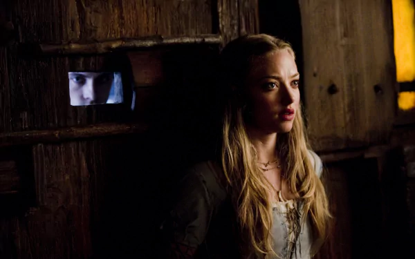 Amanda Seyfried in a dramatic scene from the movie Red Riding Hood, captured in 4K Ultra HD as a PC desktop wallpaper and background.