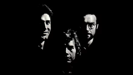 HD PC desktop wallpaper: three shadowed, high-contrast faces emerging from black, moody music-themed King Crimson aesthetic.
