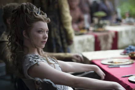 Natalie Dormer as Margaery Tyrell in a captivating scene from Game of Thrones, showcasing an elegant moment at a lavish banquet. An HD desktop wallpaper celebrating the character's allure.