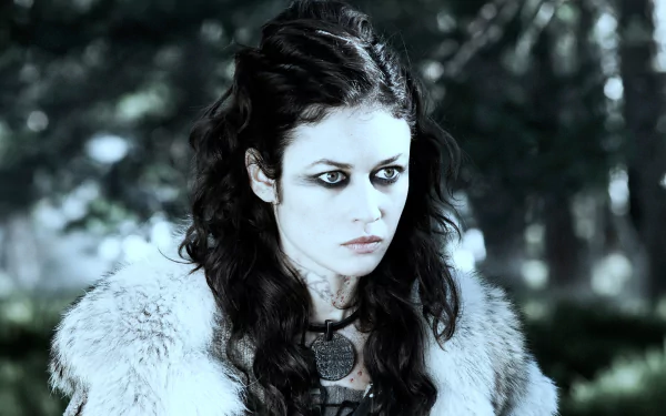 A high-resolution 4K Ultra HD PC wallpaper featuring a fierce female warrior from the movie Centurion, set against a dark, forested background.