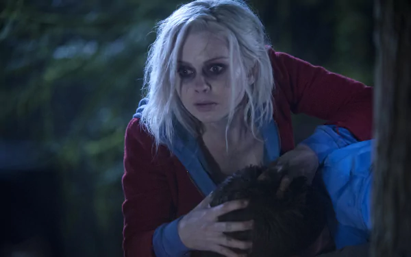 HD PC desktop wallpaper featuring a scene from the TV show iZombie with the main character in a tense moment outdoors at night.