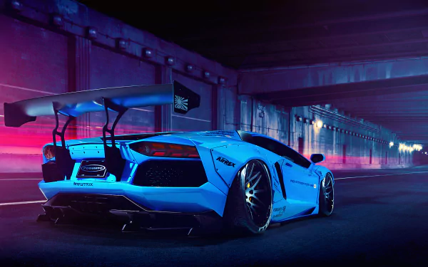 HD desktop wallpaper featuring a blue Lamborghini Aventador parked under a dimly lit bridge, showcasing its sleek design and powerful form.