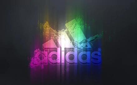 A vibrant, HD desktop wallpaper featuring the Adidas logo with a rainbow splash design on a dark background.