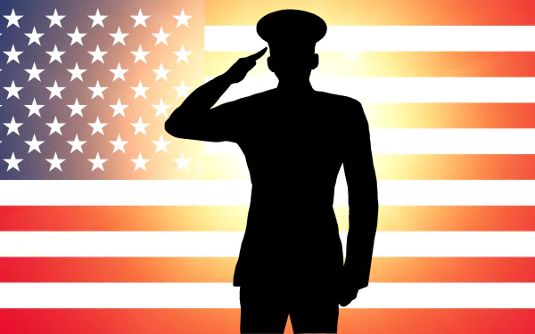 Silhouette of a soldier saluting in front of a glowing American flag, a 4K Ultra HD Memorial Day holiday PC desktop wallpaper and background.