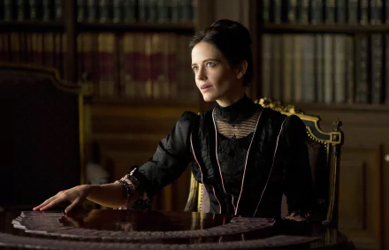 Eva Green as Vanessa Ives in *Penny Dreadful*, seated at an ornate table surrounded by books, exuding a haunting yet elegant presence in this HD wallpaper.