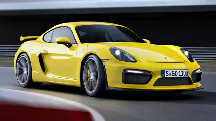 A vibrant yellow Porsche Cayman GT4 racing around a track, showcasing its sleek design and dynamic performance in a high-definition background.