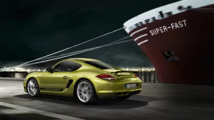 A green Porsche Cayman R sports car parked near a dock with a large ship labeled SUPER-FAST in the background, captured in a high-definition desktop wallpaper.
