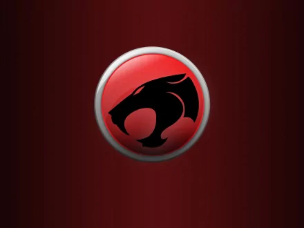 A bold HD wallpaper featuring the iconic emblem of Thundercats (1985) against a deep red background, capturing the essence of the classic TV show.