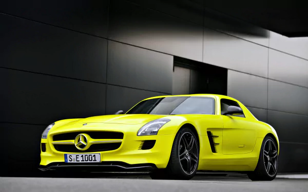 A striking yellow Mercedes-Benz SLS AMG supercar parked against a sleek, modern dark wall, showcased in crisp 4K Ultra HD quality.