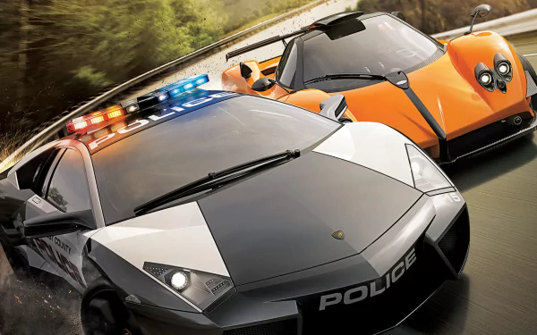 HD PC desktop wallpaper featuring a high-speed chase scene from the video game Need For Speed: Hot Pursuit with a police car pursuing an orange supercar.