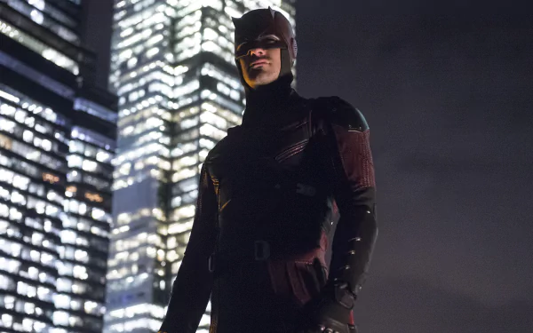 Daredevil from the TV show stands in his dark suit against a backdrop of illuminated skyscrapers, presented as a high-resolution 4K Ultra HD PC desktop wallpaper.