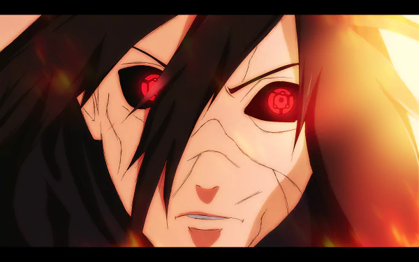 HD wallpaper of Madara Uchiha from the anime Naruto, featuring a close-up of his intense red Sharingan eyes amidst a fiery glow.
