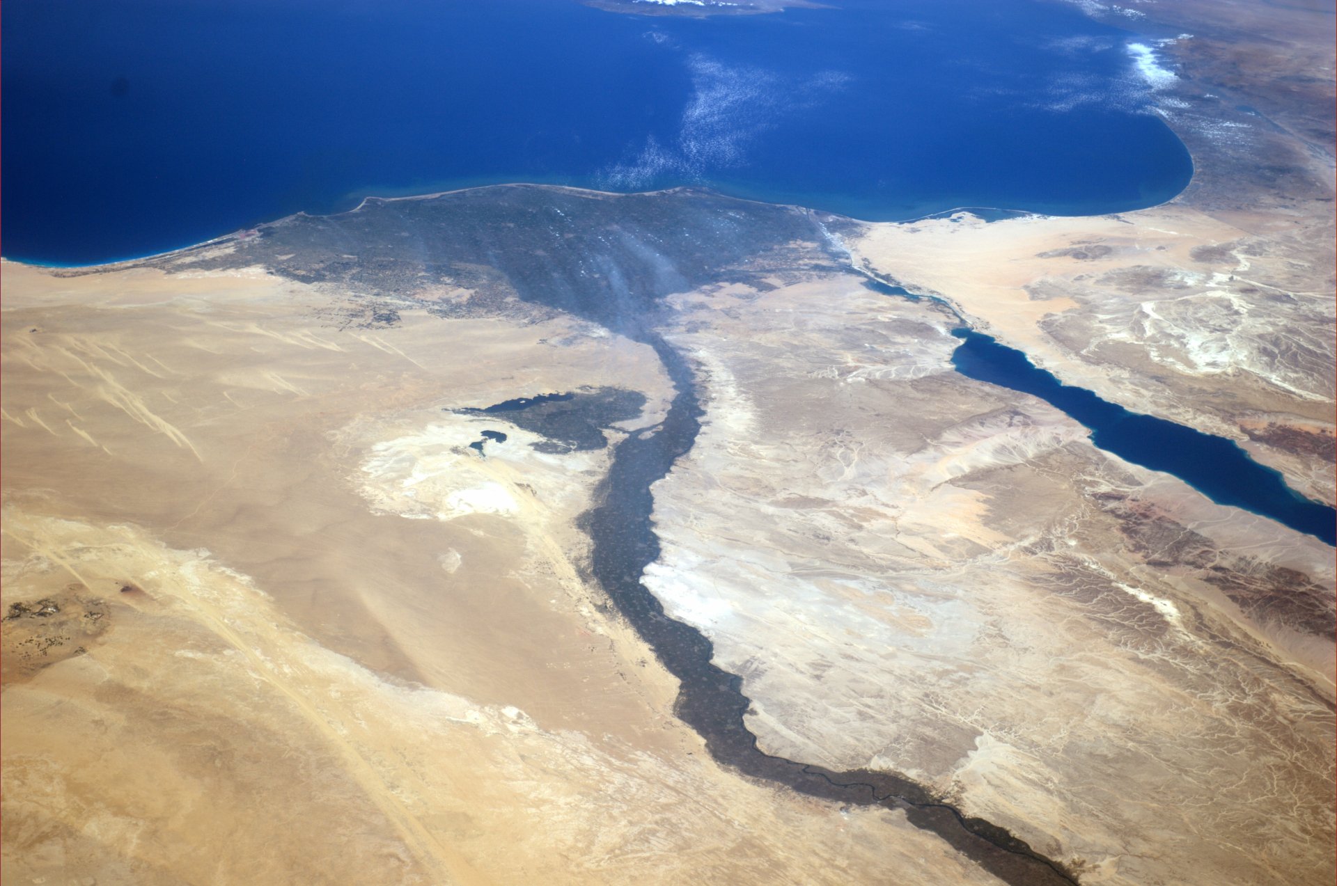 A stunning 4K Ultra HD view of Egypt from space, showcasing the Nile River, Sahara Desert, Sinai Peninsula, and surrounding Mediterranean coastline in Africa.