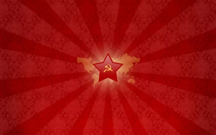 A vibrant HD wallpaper featuring a red background with rays, centered around a prominent star symbolizing communism, reflecting a man-made design.