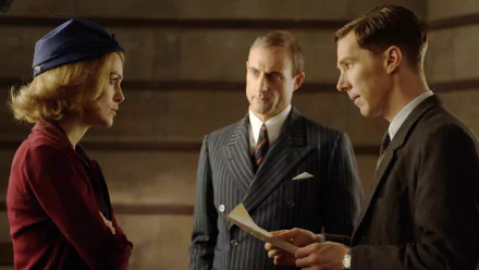 A scene from The Imitation Game featuring Keira Knightley and Benedict Cumberbatch, showcasing a tense moment between characters amidst a vintage backdrop.