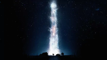 A captivating HD wallpaper from the movie Interstellar, featuring a striking vertical beam of light amidst a starry sky, with silhouetted figures and vehicles in the foreground.