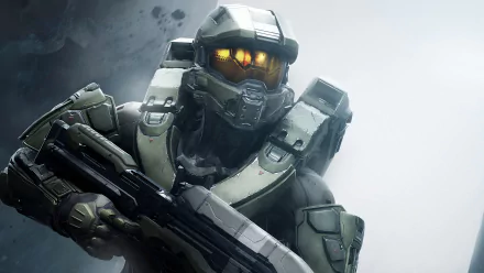 A high-definition desktop wallpaper featuring Master Chief from Halo 5: Guardians, showcasing his iconic armor and weaponry against a blurred, atmospheric background.