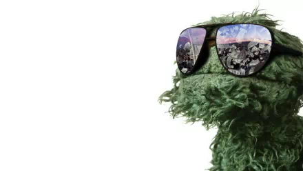 HD PC desktop wallpaper featuring a close-up of Oscar the Grouch from the TV show Sesame Street wearing reflective sunglasses against a white background.