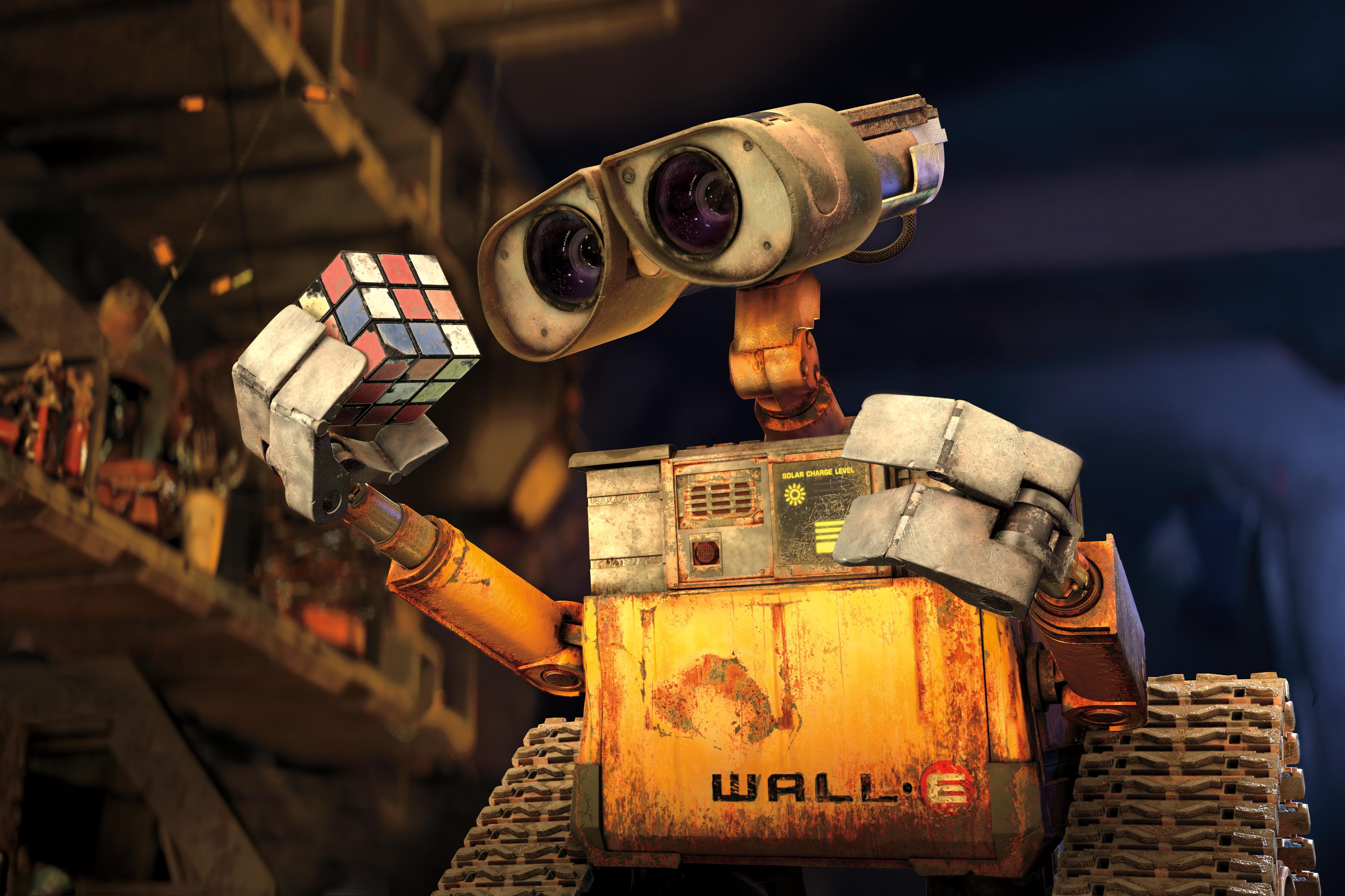 Wall-e holding a Rubik's cube, a character from Wall-E film.