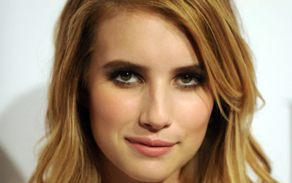 A high-definition desktop wallpaper featuring Emma Roberts, showcasing her captivating expression and stylish appearance.